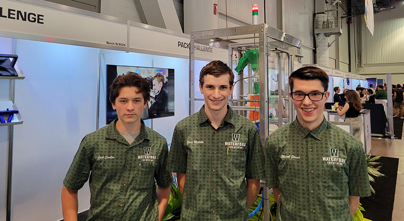Jack Sadler, Zack Mettille, and Michael Struck (left to right) represent their school, Waterford Union High School in Wisconsin, at PACK EXPO Las Vegas in September. In 2022, they won the PACK Challenge in Chicago during PACK EXPO International, so they were invited to the event in Las Vegas. 